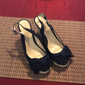 Navy sling back wedge heel.